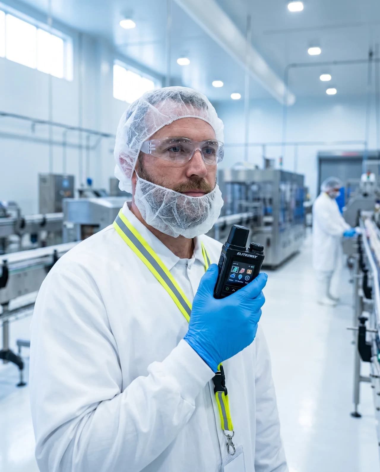 Operator using Elite2Way cellular push-to-talk radio in a food processing environment